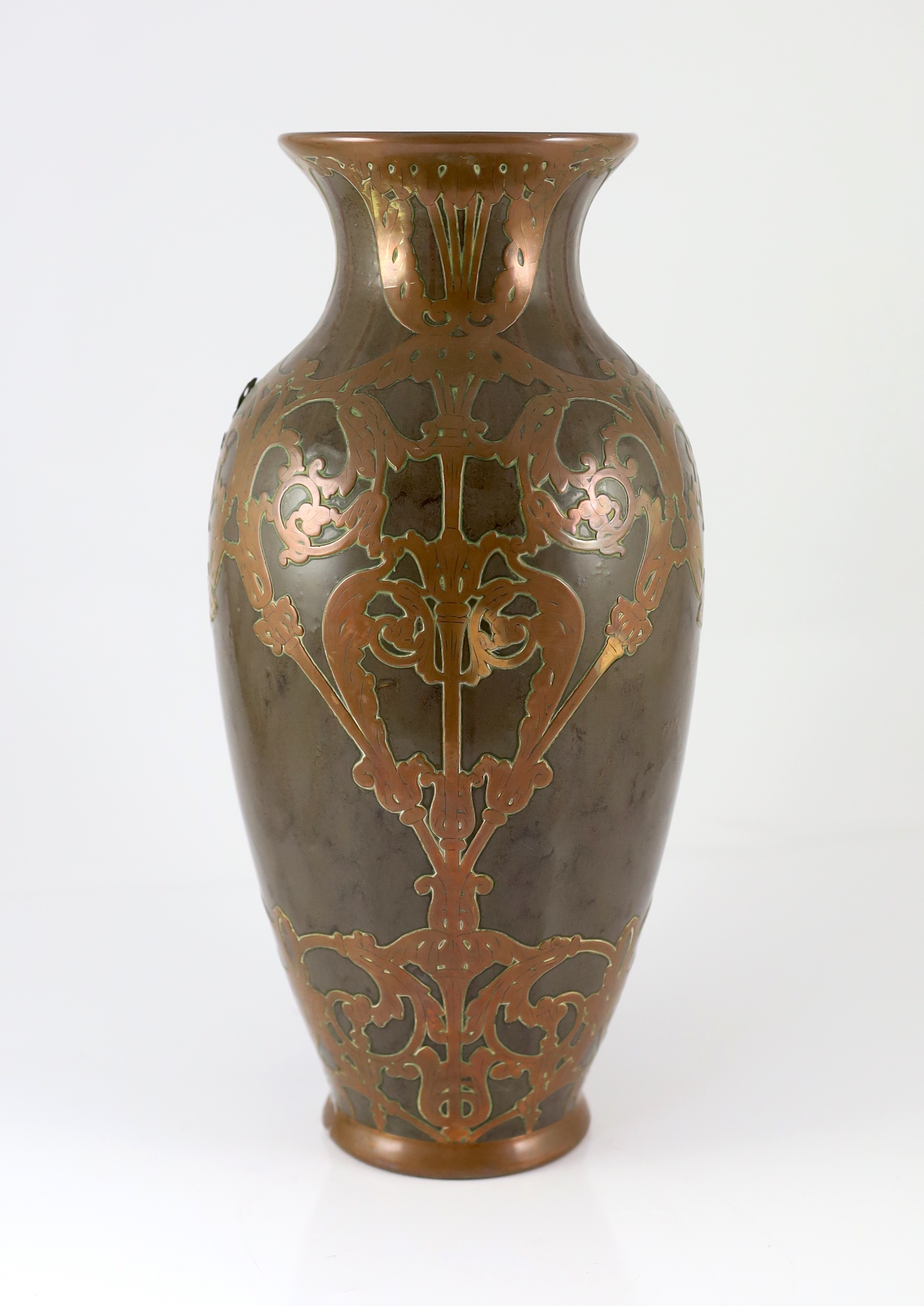 Attributed to Peter Behrens (German, 1868-1940). An Art Nouveau pottery and copper overlaid vase by Marzi & Remy, Hohr